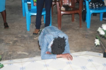 Bowed in devotion and prayer